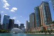 A tour boat near a fountain on the Chicago River.