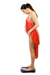 Foto: Surprised pregnacy women stand on a bathroom scale. Surprised pregnacy women stand on a bathroom scale.