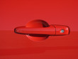 Car door handle on red sports car