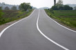 Highway with fields aside and sky above