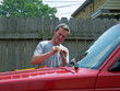 man working on car