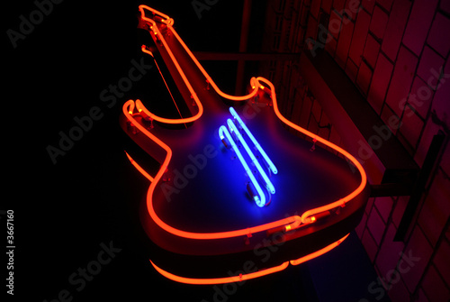 neon guitar - symbol of rock cafe