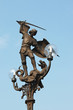 Bronze statue of the angel michael defeating the dragon