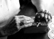 Elderly Woman's Hands Holding Her Bible and Rosary