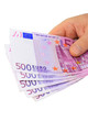 Male hand holding 500 euro notes isolated with clipping path
