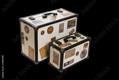 Photo: Two world travelers suitcases isolated over white Two world travelers suitcases isolated over white