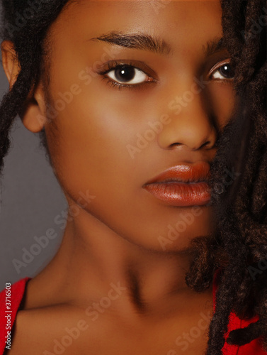 Lovely Closeup of beautiful Black woman on grey