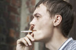 man is smoking the sigarette