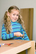 Girl helping to assemble a new furniture Girl helping to assemble a new furniture