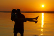 kissing couple on the evening beach dawn scenics