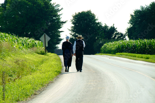Photo: Amish Couple walking down a country Lane in Lancaster PA Amish Couple walking down a country Lane in Lancaster PA