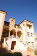 Orange and peach colored three storey mansion 