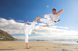 Photo: Men practicing Karate on the beach Men practicing Karate on the beach