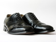 Black Brogues over white background..