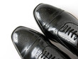 Black Brogues over white background..