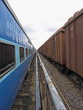 Perspective of two trains standing on a tracks. Kerala, India.