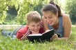 Mum and the son reads the book