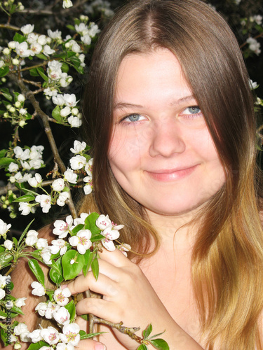 Pretty nude girl with flowers of apple