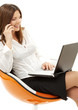 businesswoman with laptop and phone in orange chair over white businesswoman with laptop and phone in orange chair over white