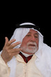older middle-eastern man with white beard, 