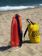 Ocean Rescue Gear in Sand-- Patrol Rescue Can and Rope Bag
