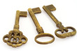 close-up of three ornamented old keys isolated on white close-up of three ornamented old keys isolated on white