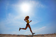 The girl runs on sand