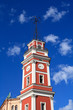 Red tower with clock in Saint Petersburg, Russia