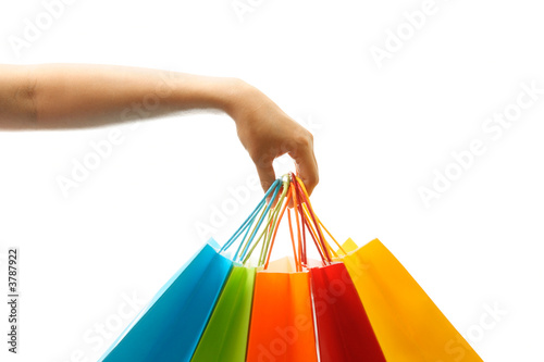 Photo: A woman hand carrying a bunch of shopping bags A woman hand carrying a bunch of shopping bags