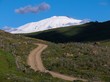 Etna innevata cielo nuvoloso