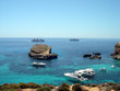 Blue lagoon at Comino island in Malta, beach and beautiful caves Blue lagoon at Comino island in Malta, beach and beautiful caves