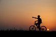 mountain biker silhouette in sunrise