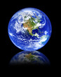 globe with reflection in front isolated on deep black background