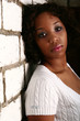 African American Girl Lean On Brick Wall