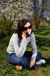 Portrait of a brunette nice girl in a park.