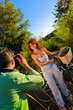 couple playing outside on a field taking pictures