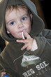 Photo: Young boy smoking a cigarette sweet Young boy smoking a cigarette sweet