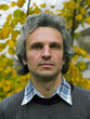 Middleaged man in a sweater and jeans close up portrait
