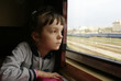The girl looks in a window of a compartment The girl looks in a window of a compartment