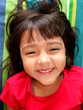 Happy smiling girl in red