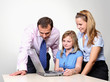 Three colleagues working at a computer Three colleagues working at a computer