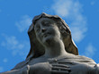Statue of the virgin Mary with a spiderweb on her face