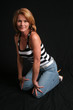 Pretty mature woman kneeling