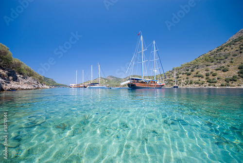 Photo: Boats anchored at a bay in the Turkish Mediterranean Boats anchored at a bay in the Turkish Mediterranean
