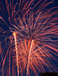 Night sky full of pink and gold fireworks