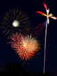Cluster of fireworks bursts and a pinwheel