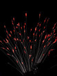 Fountain firework with red flames at the streamer tips