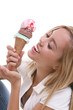 Photo: A pretty young girl eating an ice cream cone A pretty young girl eating an ice cream cone