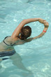 Girl in pool doing aerobic