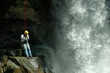 rescuer on duty in front of water falls